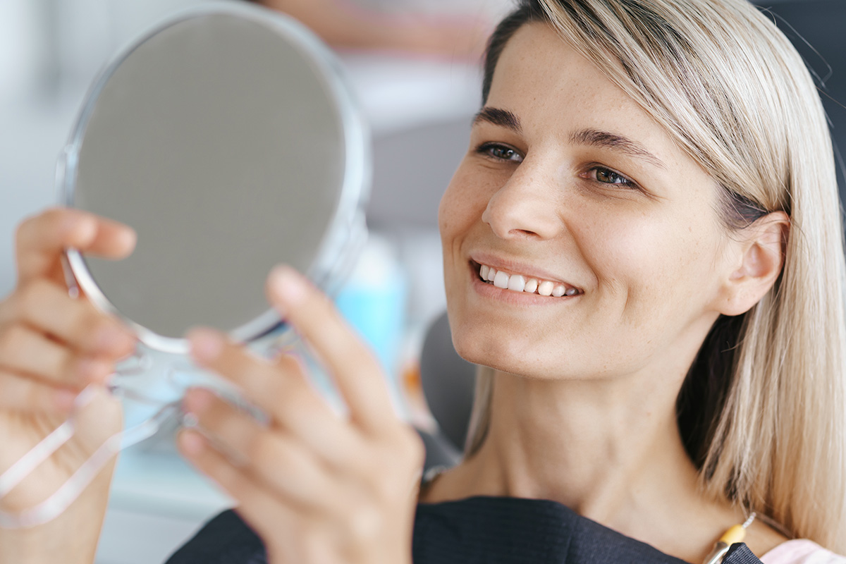 Professional Teeth Whitening vs. At-Home Treatments - SoBro Blog - Dental Health Tips and Resources